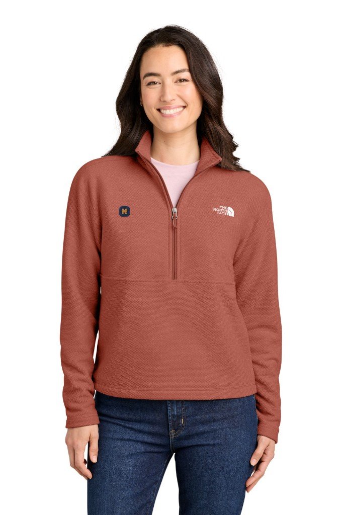 Rust North Face quarter-zip pullover with the maker logo and a small chest mark
